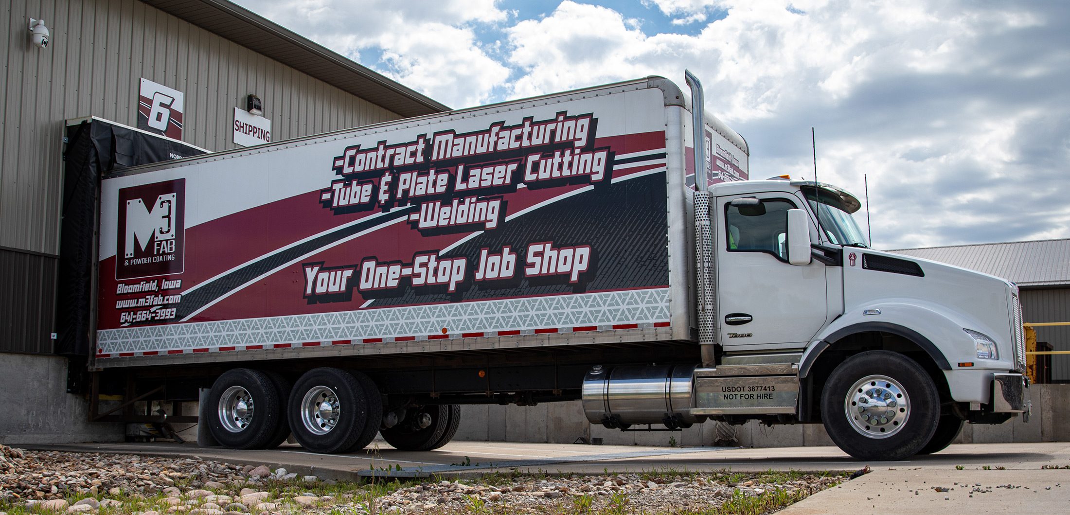 M3 delivery truck being loaded at the dock